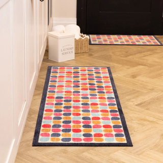 Door mat on floor two different sizes 