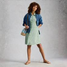 Load image into Gallery viewer, Woman in dress with denim jacket and bag on grey background 
