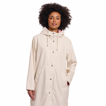 Load image into Gallery viewer, Close view of model wearing Rino &amp; Pelle Reversible Raincoat in Birch Pink
