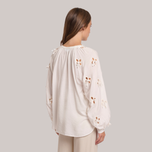 Load image into Gallery viewer, back view of model wearing the Rino &amp; Pelle Long Balloon Sleeve Blouse, With a grey background.
