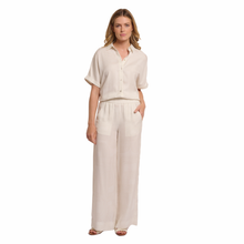 Load image into Gallery viewer, Full view of model wearing Rino &amp; Pelle Wide Leg Pants in the colour Snow White
