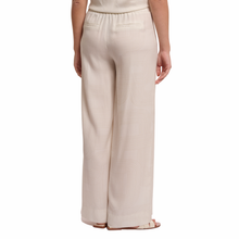 Load image into Gallery viewer, Back view of model wearing Rino &amp; Pelle Wide Leg Pants in the colour Snow White
