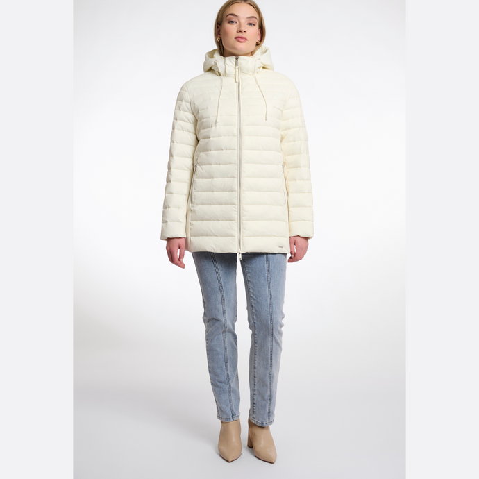 Woman wearing a cream puffer jacket on a white background