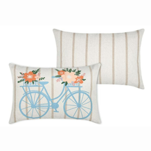Load image into Gallery viewer, Two decorative throw pillows on a white background. The front pillow features a light blue bicycle with orange and peach flowers in the basket, set against a beige and white vertically striped fabric.
