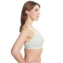 Load image into Gallery viewer,  A side profile shot of a model wearing the Royce Maisie Wirefree Smooth Cup Bra in Ivory.

