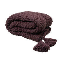 Load image into Gallery viewer, A product shot of the Collins throw in Aubergine folded with two tassels 
