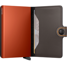 Load image into Gallery viewer, Two open leather wallets, one orange and one black, on a white background.
