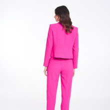 Load image into Gallery viewer, A model showing the back of the Badoo Fuschia Box Jacket.
