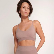 Load image into Gallery viewer, A close up shot of a model wearing the Sloggi Ever Infused Aloe Bralette in Mauve. 
