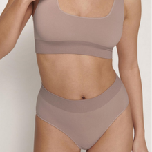 Load image into Gallery viewer, A close up shot of a model wearing the Sloggi Ever Infused bra and high waisted brief. 
