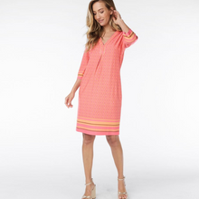 Load image into Gallery viewer, female model wearing esqualo dress in coral print with hand on hair
