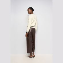 Load image into Gallery viewer, Rear of model with cardigan and trousers 

