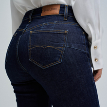 Load image into Gallery viewer, Dark blue jeans with a visible brand label on a plain background
