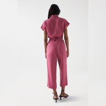 Load image into Gallery viewer, Model wearing Salsa straight cropped leg jumpsuit from the back.

