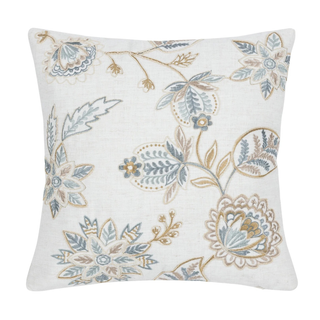 Decorative pillow with floral embroidery on a white background