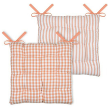 Load image into Gallery viewer, Two square quilted floor cushions with peach and white patterns, one in a gingham check and one in vertical stripes, each with peach ribbon ties, shown on a white background.
