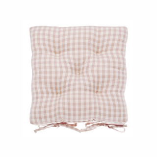 Pink and white checkered cushion on a white background