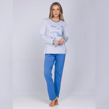 Load image into Gallery viewer, A woman modeling a light gray long-sleeve pajama top with blue text reading 'Sleep like a STAR Star' and blue pants, standing against a light gray studio background.
