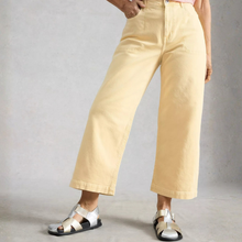 Load image into Gallery viewer, Person wearing beige wide-leg pants and sandals on a plain background
