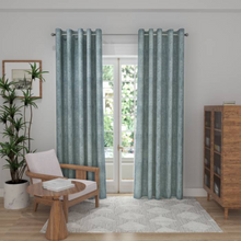 Load image into Gallery viewer, Eyelet curtains on a patio door with silver pole 

