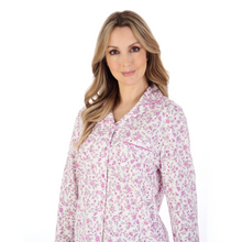 Load image into Gallery viewer, A close up of a model wearing the Slenderella Ditsy Floral Jersey Tailored Pyjama Set in Pink. 

