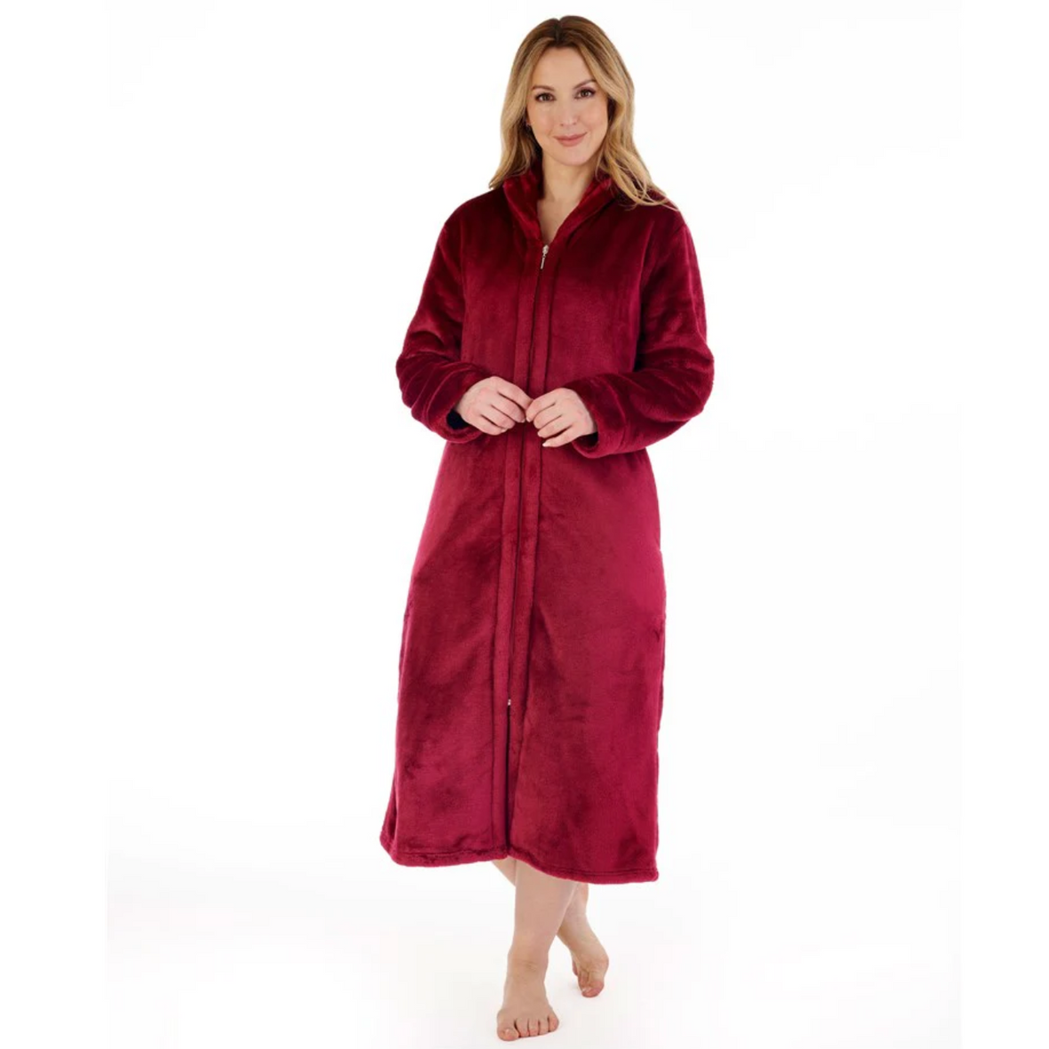 A model wearing the Slenderella Luxury Flannel Fleece Zip Through Housecoat in Raspberry. 