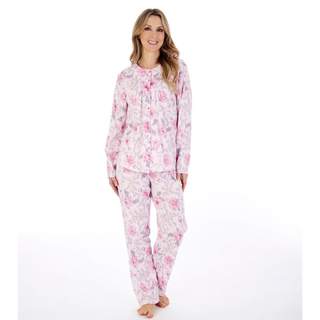 A model wearing the Slenderella Picot Trim Jersey Pyjama Set in Pink. 