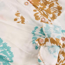 Load image into Gallery viewer, Close-up of a patterned shirt with brown and blue designs on a white background
