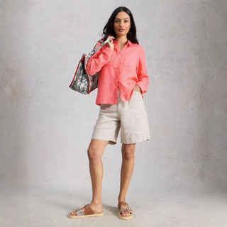 Image of Model standing wearing the White Stuff Sophie Linen Shirt, with a white background.