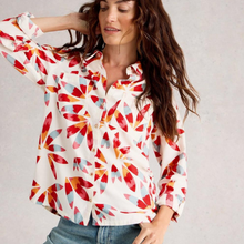 Load image into Gallery viewer, Woman wearing a colorful patterned blouse against a plain background
