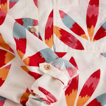 Load image into Gallery viewer, Close-up of a shirt with colorful geometric pattern
