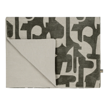 Load image into Gallery viewer, Folded fabric with abstract pattern on a white background

