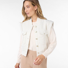 Load image into Gallery viewer, female model wearing short tweed gilet in offwhite colour smiling
