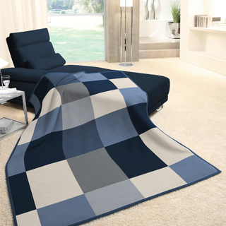 throw over the end of the couch draping to the floor 