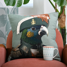 Load image into Gallery viewer, Parrot Face cushion on Chair with cup in front 
