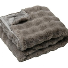 Load image into Gallery viewer, A folded plush faux fur blanket in a warm taupe-gray color, showing a soft inner lining on a plain white background.
