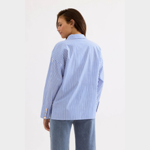 Load image into Gallery viewer, Person wearing a blue and white striped shirt on a plain background
