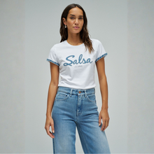 Load image into Gallery viewer, Woman wearing a white t-shirt with 'Salsa Jeans' text and blue jeans on a gray background
