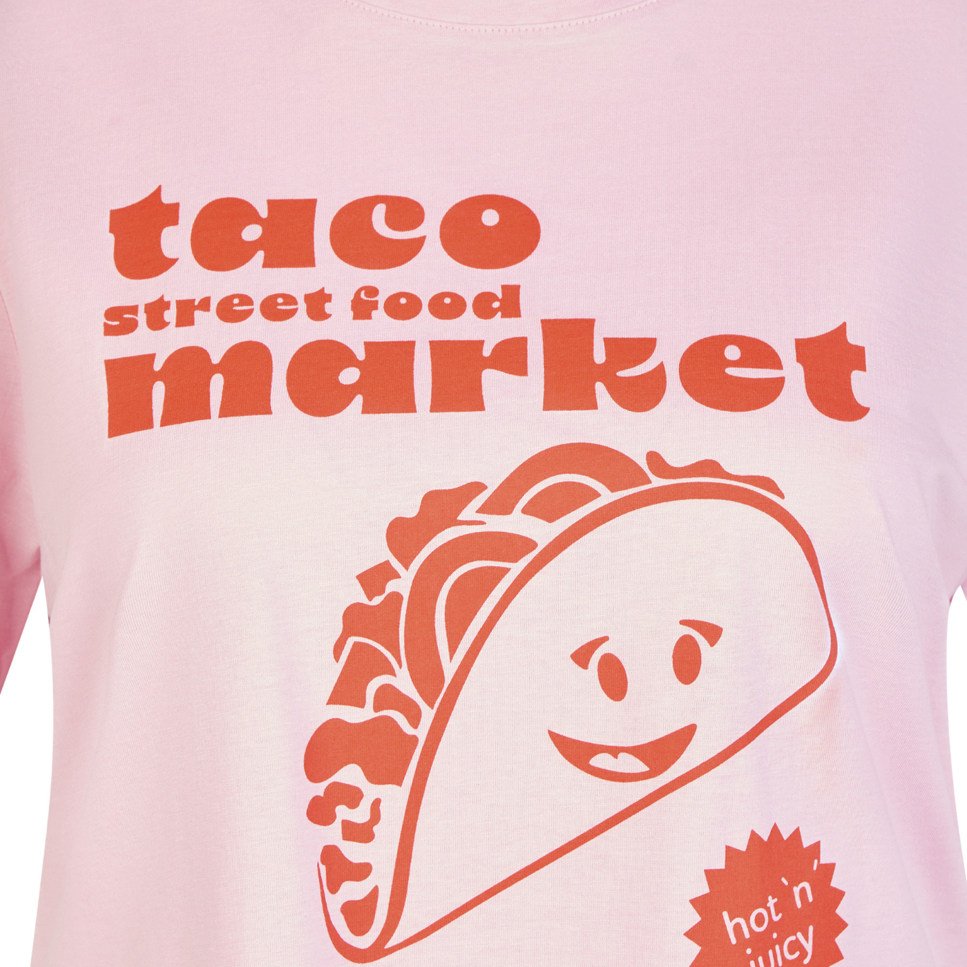 Load image into Gallery viewer, Pink t-shirt with a smiling taco graphic and 'taco street food market' text on a pink background