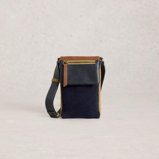 Small black crossbody bag with brown accents on a light gray background