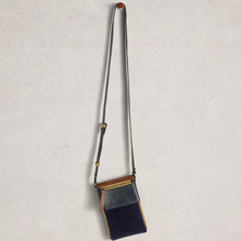 Load image into Gallery viewer, Small crossbody bag with a strap on a light gray background
