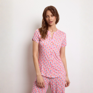 Model wearing short sleeve blouse with matching pant again white background 