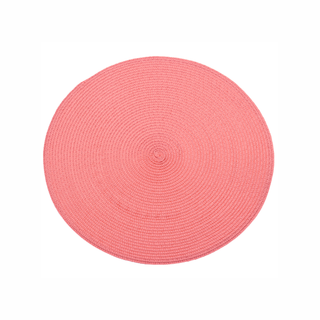 Round pink placemat on a white background