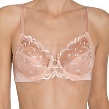 Load image into Gallery viewer, A model wearing the Triumph Modern Finesse W02 Bra in Natural. 
