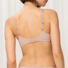 Load image into Gallery viewer, A model showing the back details of the Triumph Wild Peony Florale Wired Padded Bra in Blush. 
