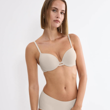 Load image into Gallery viewer, Woman wearing a beige bra and underwear set on a white background
