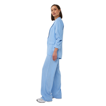 Load image into Gallery viewer, Side shot of Model wearing Esqualo Linen Trousers in the colour Pacific, with a white background.
