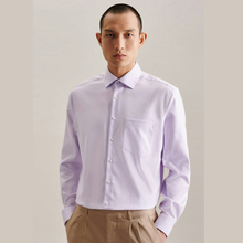 Load image into Gallery viewer, A man wearing a light lavender long-sleeve button-down dress shirt with a chest pocket, paired with khaki trousers, against a neutral beige background.
