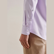 Load image into Gallery viewer, Close-up of a person wearing a light lavender long-sleeve dress shirt with buttoned cuffs and tan trousers, shown against a plain light beige background.
