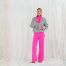 Load image into Gallery viewer, Person wearing a gray sweater and pink pants with a matching pink scarf against a white background

